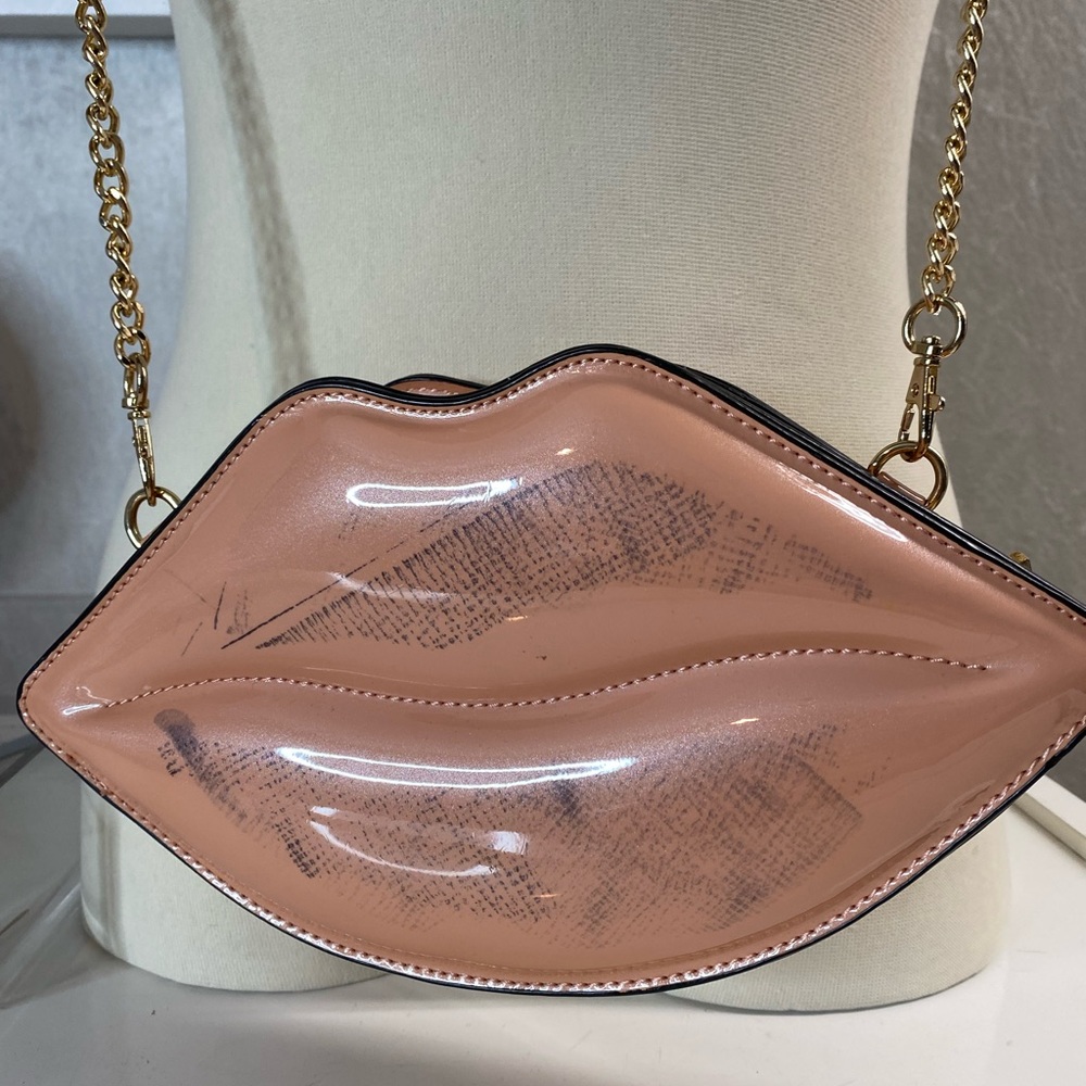 Valentine’s lips purse
